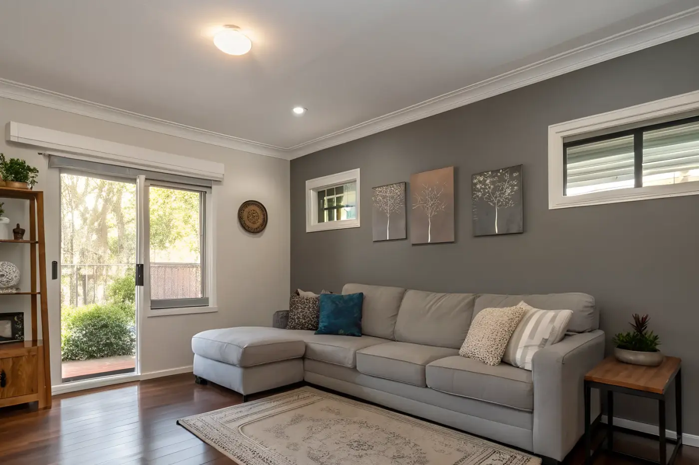 A tidy living area and kitchen in a cleaned home